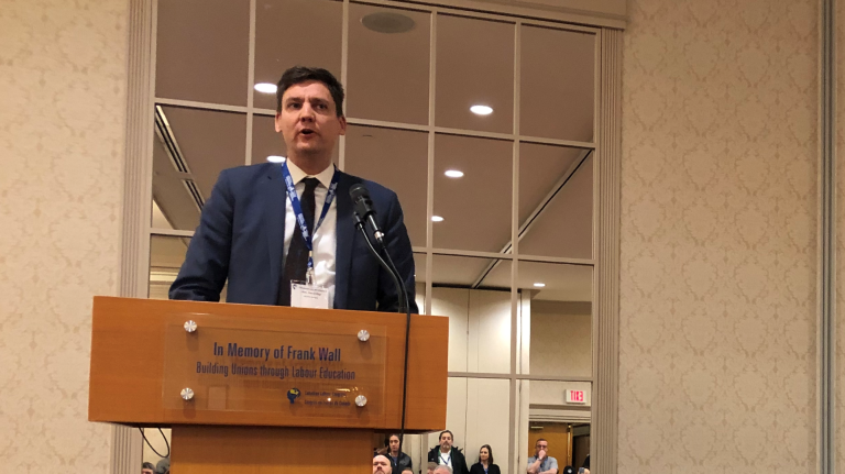 David Eby at a podium