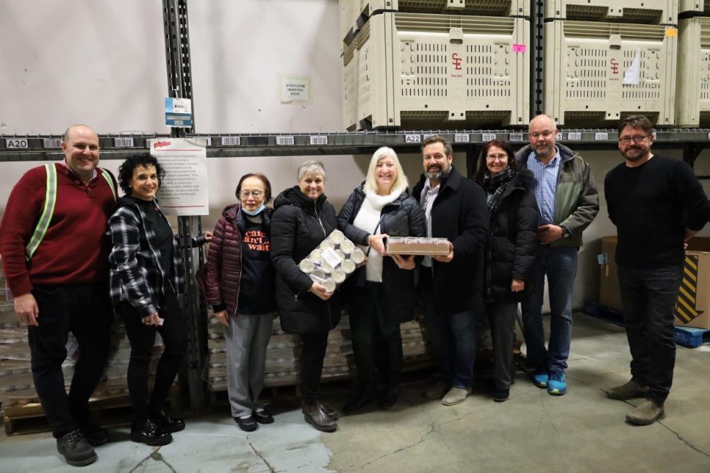 Directors of the Union Protein Project and representatives of the Greater Vancouver Food Bank pose for a group photo