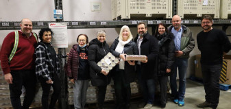 Directors of the Union Protein Project and representatives of the Greater Vancouver Food Bank pose for a group photo