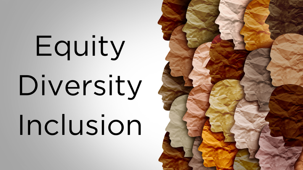 Paper mache faces in differeint colours and the words "Equity Diversity Inclusion"