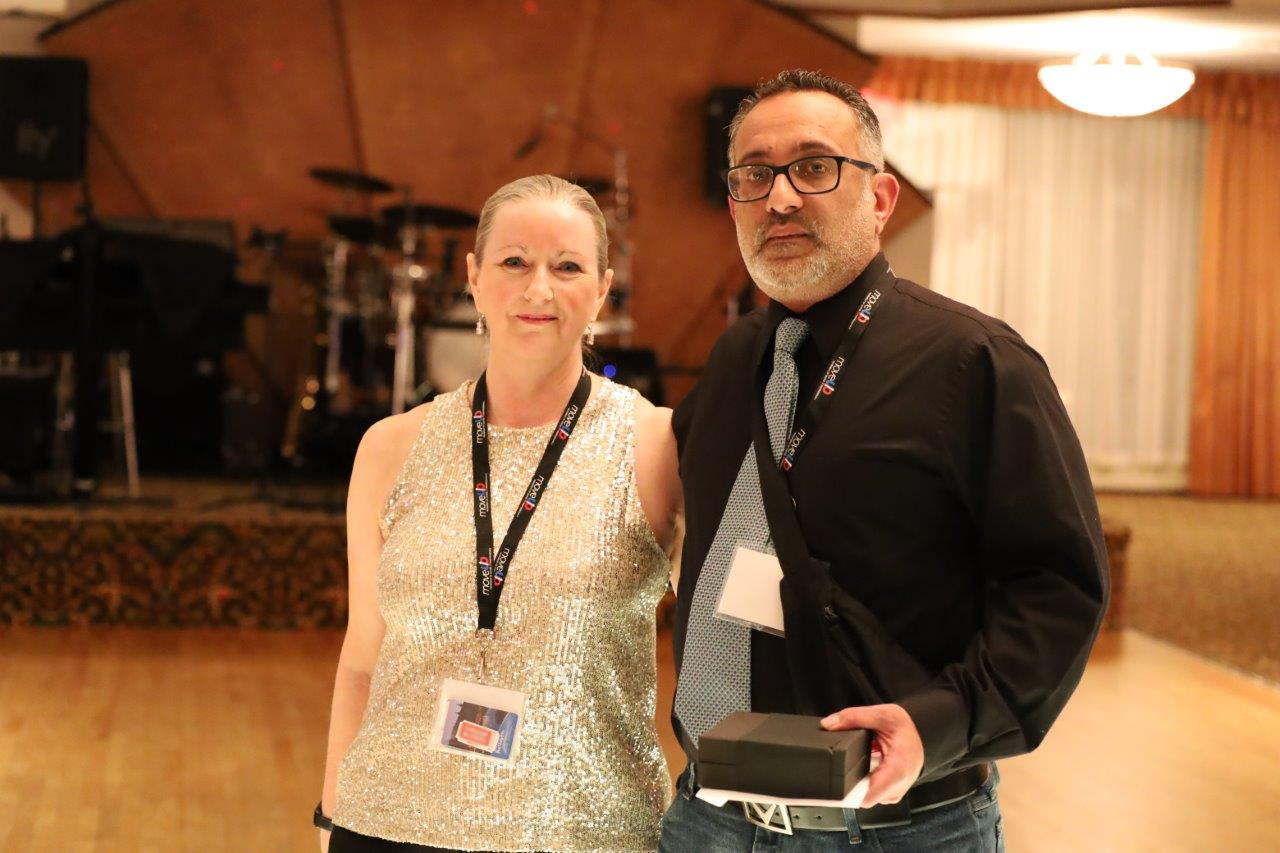 Lori Mayhew and Tejbir Basi pose for a photo