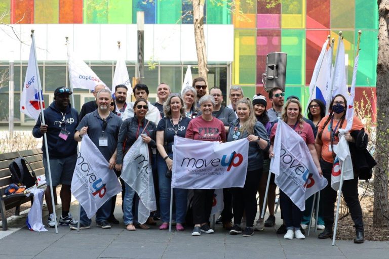 MoveUP delegates at CLC Convention 2023 pose for a group photo in front of the Montreal Convention Centre