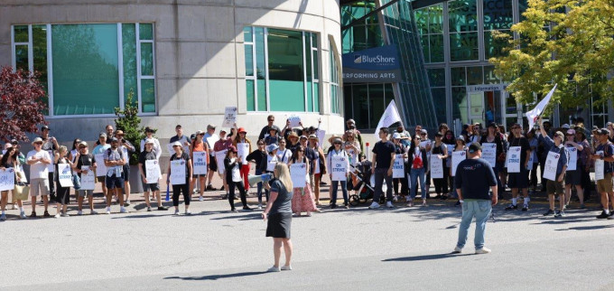 MoveUP members who work at CapU gather for a rally on campus