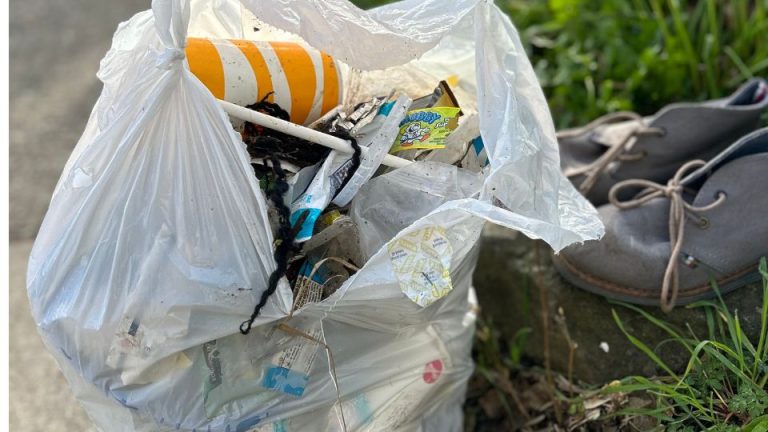 a plastic bag filled with garbage