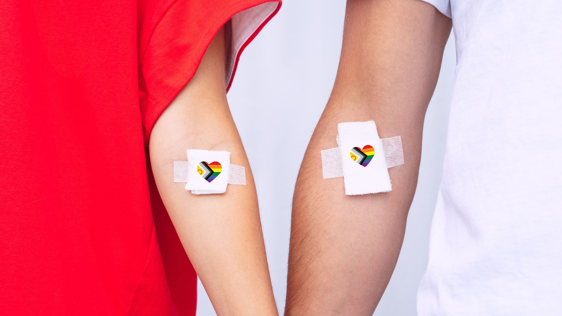 Arms with bandage with intersex pride flag in shape of heart on each bandage