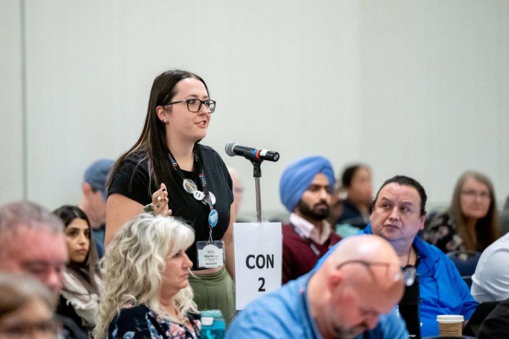 Woman speaking at a Con mic at Convention