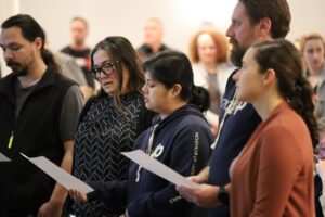 MoveUP councillors holding paper while swearing-in