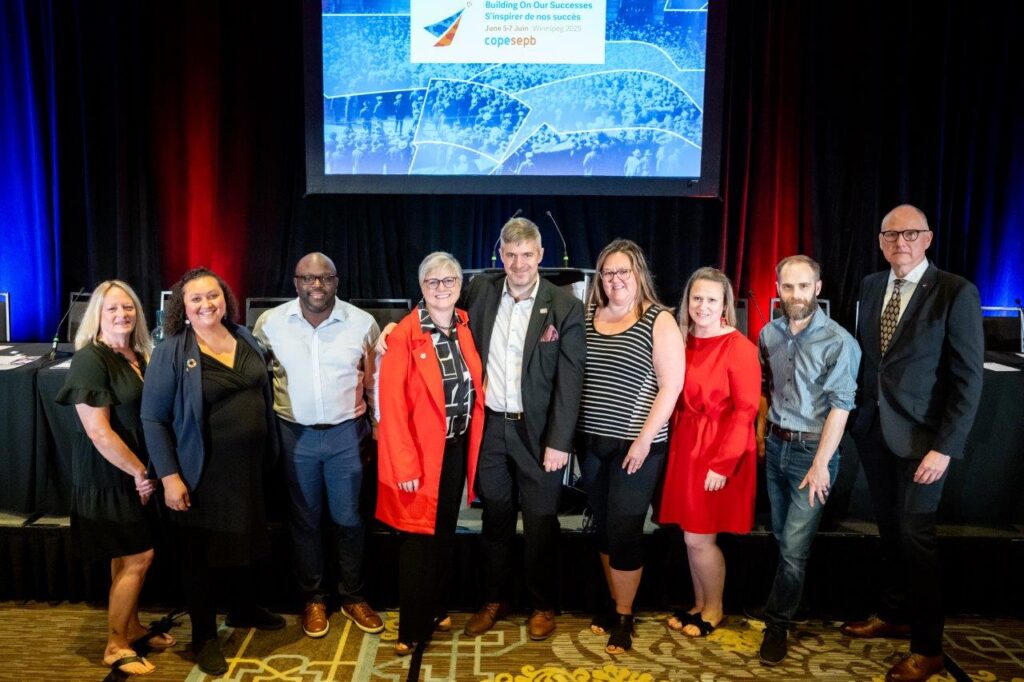National Executive Board of COPE SEPB pose for a photo on the Convention stage