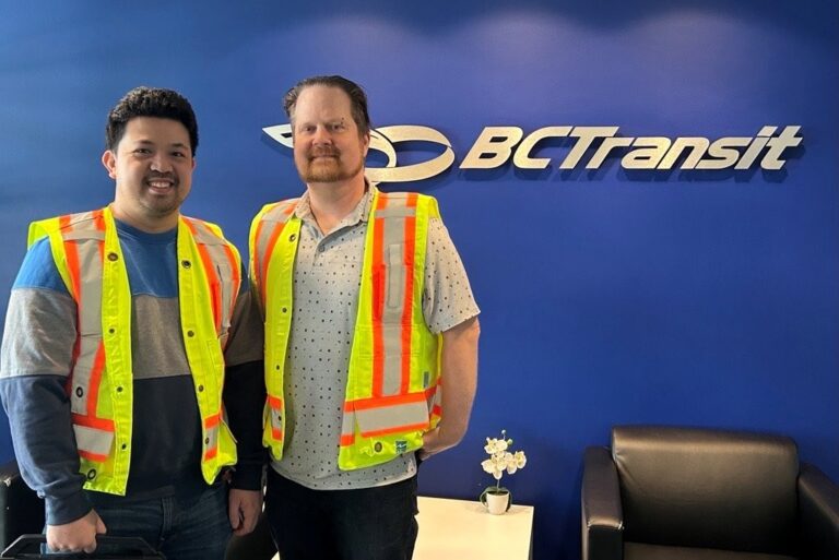 MoveUP members pose in front of BC Transit sign