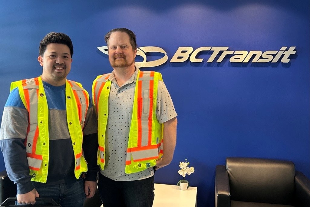 MoveUP members pose in front of BC Transit sign